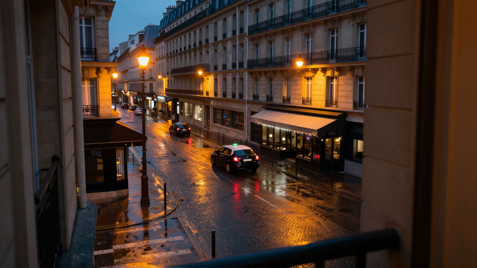 A Paris street at night seen from a high window, quiet after the evening